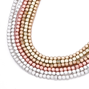 Detailed close-up of cube hematite spacer beads in silver, gold and rose gold for DIY