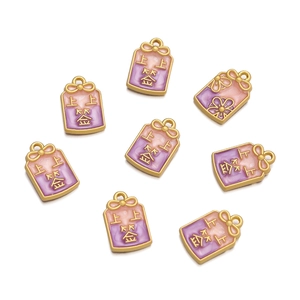 Macro detail of eight pink and purple enamel charms with lucky Chinese characters