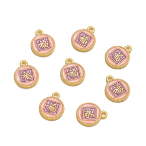 Macro shot of 8-piece pink and purple alloy Fu charms for DIY jewelry making