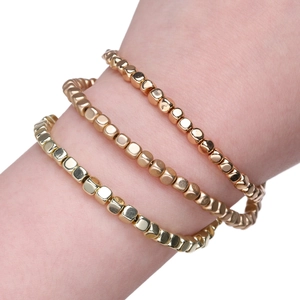 Three-piece set of cubic hematite bead bracelets in gold, rose gold, and bronze tones