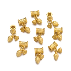 Detailed view of matte gold lotus seed pod charms for DIY jewelry making and bracelets