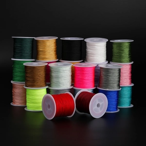 Multiple spools of colorful 0.4mm polyester cord for DIY jewelry and knotting