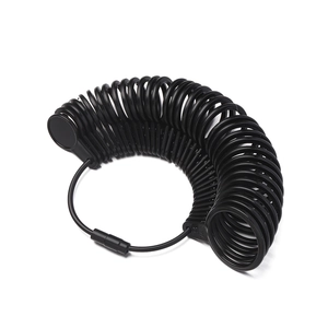 Detail view of black plastic ring sizer set with clear numeric scale for finger measuring