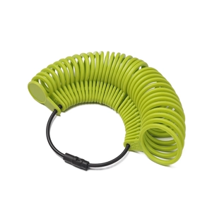 Detail view of green plastic ring sizer tool with precise UK size and circumference scales