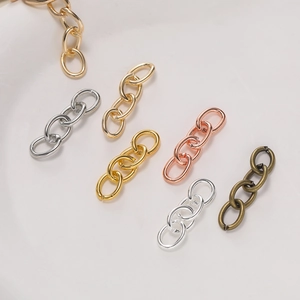 Detail of four-link metal chains in silver, gold, and bronze for DIY jewelry making
