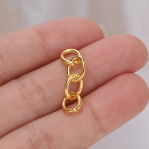 Close-up of a bright gold 4-link metal extension chain for DIY jewelry making