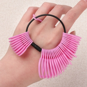 Detailed view of pink plastic ring sizer set showing accurate size scales for finger measurement