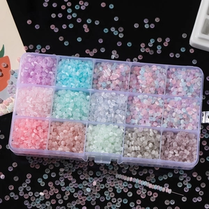 Close-up of 15-compartment organizer box with colorful 2x4mm cat eye glass beads for DIY jewelry