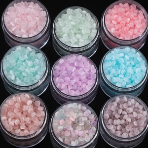 Detail view of 9-grid set of 2x4mm frosted cat eye beads in various pastel colors