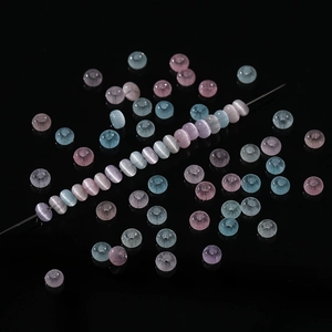 Macro shot of 2x4mm colorful glass cat-eye beads for DIY jewelry making and bracelets