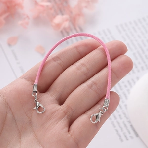 Detailed close-up of 2mm pink braided cord featuring dual silver alloy lobster clasps