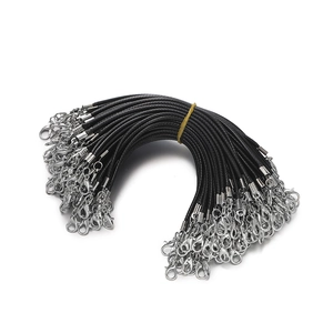 Detailed view of bulk black 2mm waxed cord lanyards with silver lobster clasps and chains