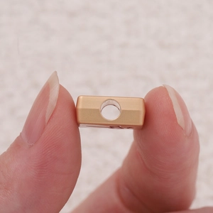 Close-up of red enamel mahjong money house charm bead for DIY jewelry making