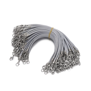 Macro detail of bundle of grey 2mm waxed cord lanyards with silver lobster clasps