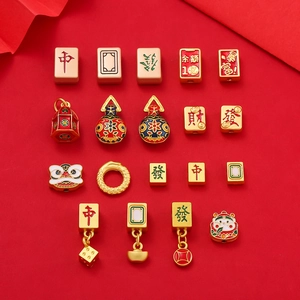 Close-up of gold-plated Chinese mahjong and lucky charm beads for DIY jewelry making