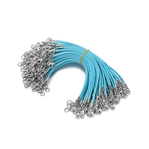 Macro shot of 2mm light blue wax cord bundle with dual silver alloy lobster clasps