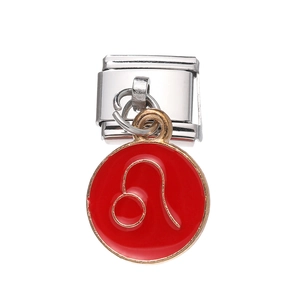 Detail of stainless steel charm with red enamel and golden Leo zodiac sign symbol