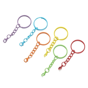 Close-up of colorful metal lobster clasps and keyrings in six vibrant painted colors