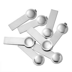 Detailed top view of polished stainless steel modular bracelet assembly tools on white background
