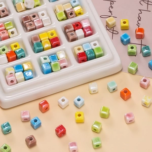 Close-up of 6.5mm square ceramic beads in vibrant colors for DIY jewelry making