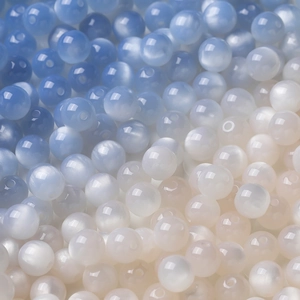 Macro shot of colorful resin beads with cat eye effect for DIY jewelry making