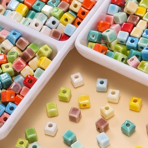 Macro shot of 6.5mm colorful ceramic cube beads with glossy glaze for DIY jewelry making