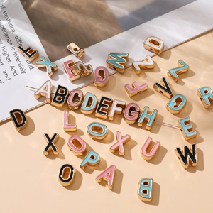 Detailed view of colorful 10mm enamel alphabet beads for DIY jewelry making
