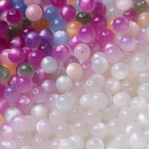 Macro shot of 8mm to 12mm resin beads with cat-eye texture for DIY jewelry making
