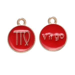 Macro detail of red enamel Virgo zodiac charm with gold finish for DIY jewelry