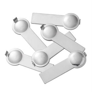 Macro view of six stainless steel modular bracelet assembly tools on a plain white background