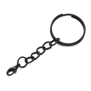 Detail of matte black metal keychain with flat ring, chain links, and lobster clasp