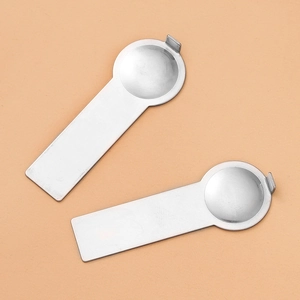 Detailed macro view of silver stainless steel tools for modular bracelet DIY assembly
