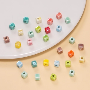 Close-up of 6.5mm colorful cube ceramic beads with glossy finish for DIY jewelry crafts