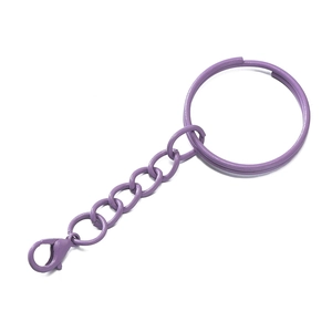 Detail view of a purple lacquered metal keychain with a split ring and lobster clasp