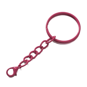 Close-up of rose red painted metal keychain with lobster clasp and connecting chain links