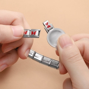 Stainless steel Italian charm bracelet assembly tool with butterfly link detail