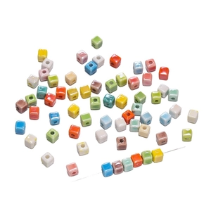 6.5mm colorful ceramic cube beads for DIY jewelry making displayed on metal pins