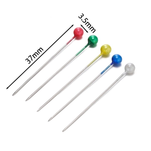 Macro view of 37mm sewing pins with 3.5mm colorful plastic ball heads and metal shafts