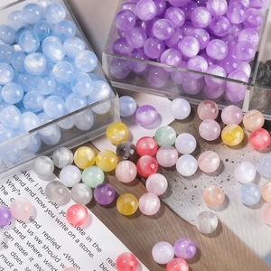 Macro shot of 8/12mm iridescent mermaid resin beads for DIY jewelry making crafts