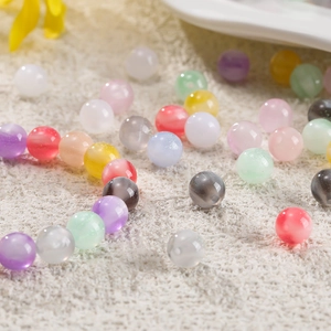 Macro shot of 8-12mm colorful resin beads with cat-eye effect for DIY jewelry making