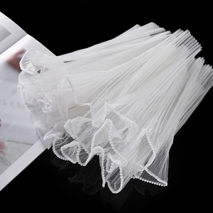 Detailed view of white multi-layer wave gauze with pearl edge for floral and gift wrapping