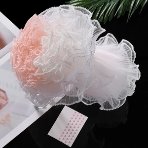 Detail of multi-layer wavy gauze fabric with delicate pearl edges for bouquet decoration