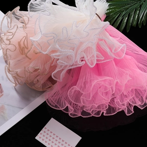 Close-up of layered wave tulle with pearl trim for floral and gift decoration