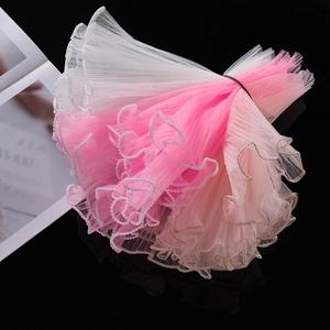 Macro detail of wave organza ribbon with pearl edges and metallic trim for gift wrapping