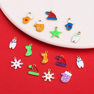 Colorful Christmas enamel charms including Santa hats and snowflakes for DIY jewelry making