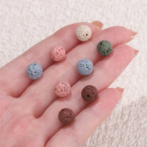 Macro detail of colorful porous lava rock beads for DIY essential oil jewelry making
