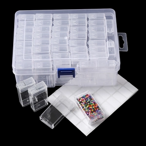Detailed view of clear plastic organizer box with multiple small inner compartments.