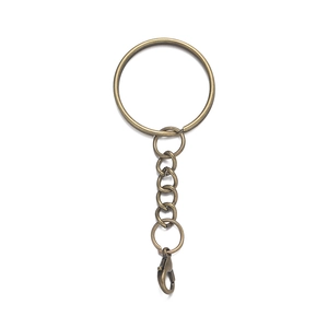 Detailed view of antique bronze 25mm metal keychain with flat ring and lobster clasp