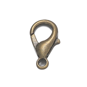 Detailed close-up of a bronze lobster clasp connector for DIY jewelry making