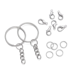 Flat lay of silver metal key ring set with lobster clasps and chains for DIY crafts